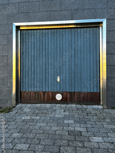 Closed Sectional Garage Gate in Modern Building Outdoor.