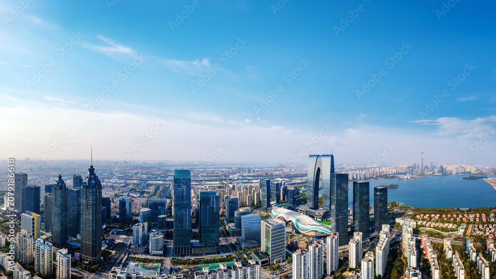 Fototapeta premium Panoramic View of Modern Urban Skyline by Water