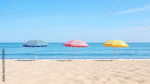 Beach with colorful striped umbrellas