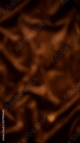 Romantic Heart Shaped Bokeh Lights Fading on Brown Silk Fabric Background