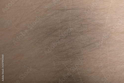 Photos Close up of a tarnished and scratched metal background showing wear and tear