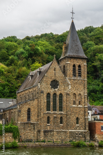Schilderij op canvas The Church of Saint Paul along the Meuse River in the picturesque town of Dinant