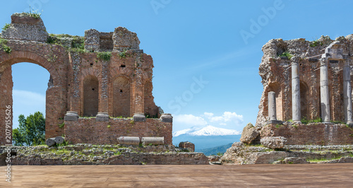 Ancient Greek theater of Taormina with Mount Etna in the background, Sicily, Italy
