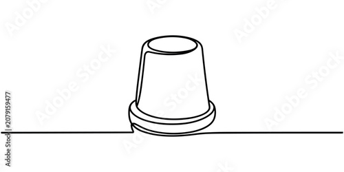 Foto Black line of a thimble on a line black and white sewing protection finger guard