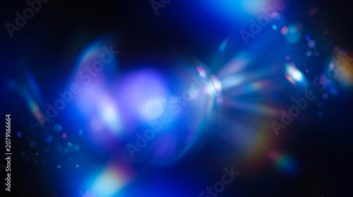 Abstract blue light bokeh background with glowing lens flare and futuristic energy effect
