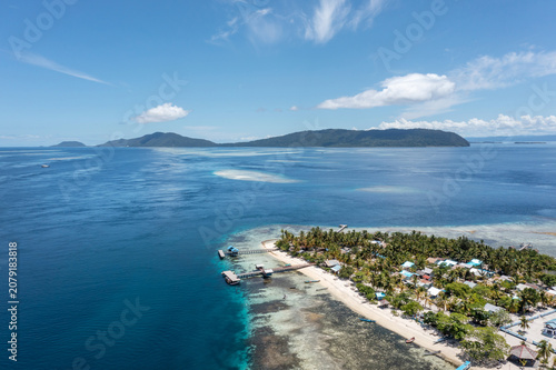 Fotografía Raja Ampat island village surrounded by coral reef and tropical blue lagoon from