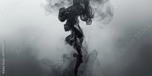 Black smoke swirling against a gray background