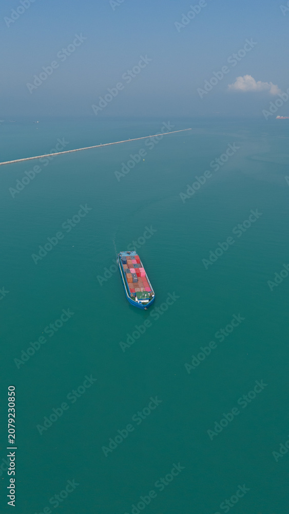 Fototapeta premium Aerial view from a container drone. Container ships in export-import and logistics business Transporting goods to large ports Worldwide shipping and logistics business International business abroad