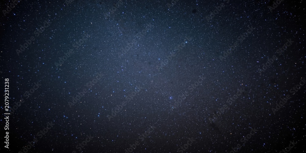 Fototapeta premium Starry night sky with twinkling stars on dark background