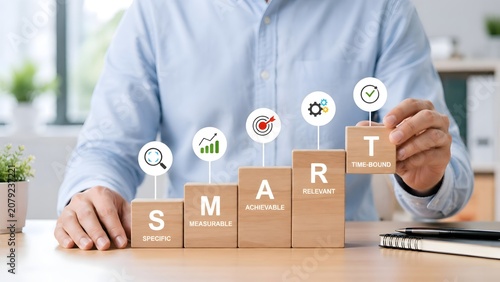 SMART goals planning concept with wooden blocks illustrating specific measurable achievable relevant time bound framework for business success and strategic management