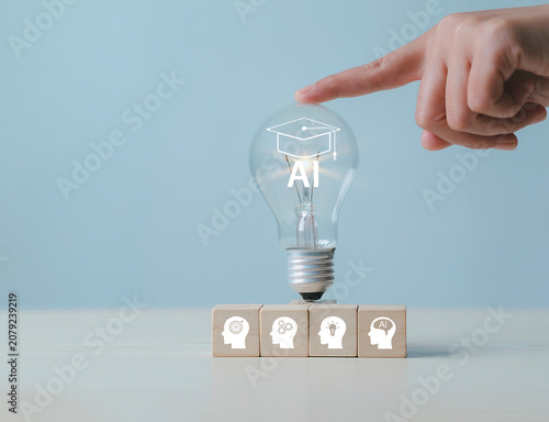 Wooden blocks with light bulbs, artificial intelligence (AI) learning, educational tools, video-based instruction, digital courses, online lessons, e-learning concepts.