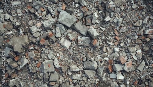 Crushed concrete and brick debris on the ground