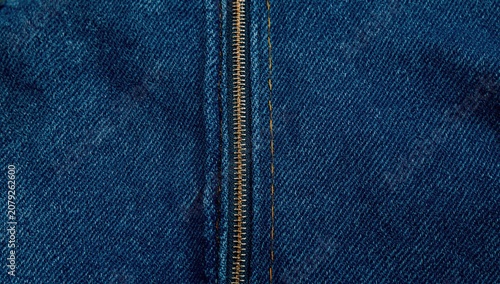 Close-up of a denim fabric with a zipper detail
