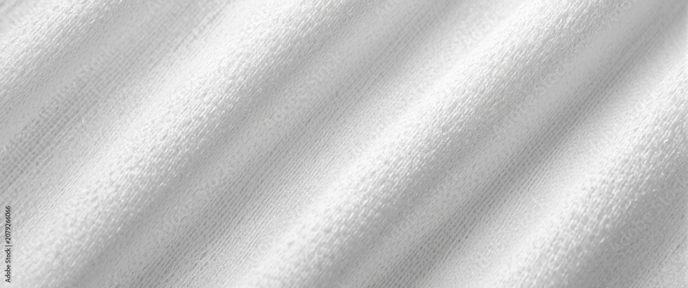 Fototapeta premium White textured fabric with subtle ridges and folds