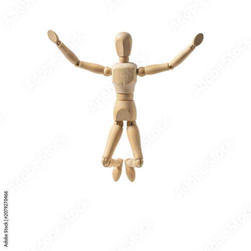 An articulated wooden artist mannequin with joints in a dynamic running pose on a white studio background showing smooth texture concept of athletic motion