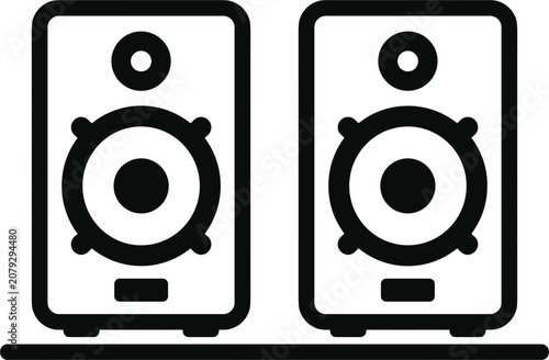 Studio monitor speakers on a desk in a minimalist setup