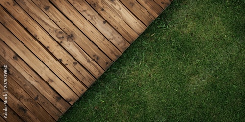 Wooden patio next to a gras...
