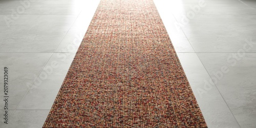 Woven runner rug on a light...