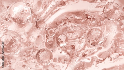 Pink liquid with bubbles an...