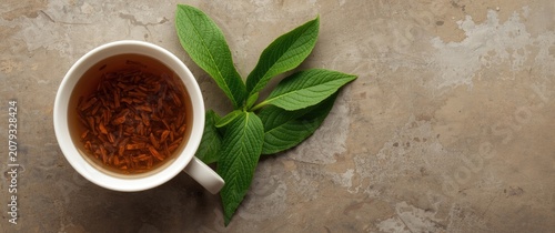 Cup of herbal tea with fres...