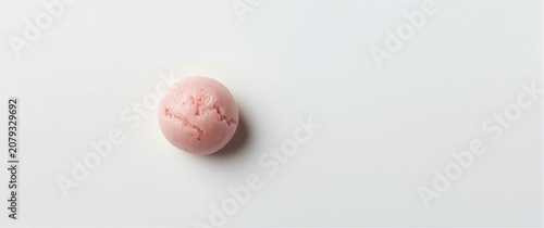 Pink ice cream scoop on a w...