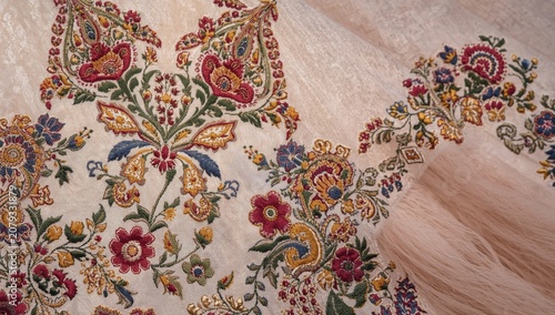 Floral paisley Mughal embroidery accented by Kashmiri tanka neckline style details