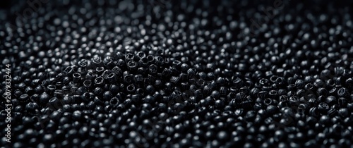 Black plastic beads scatter...