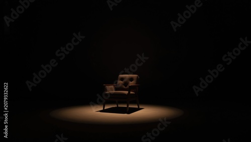 Single chair on stage in da...