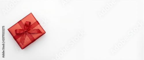 Red gift box with ribbon on...