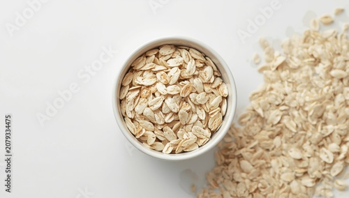 Oats in a bowl with spilled...