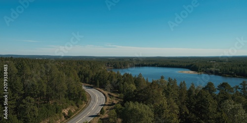 Winding road alongside a tr...