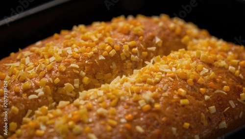 Baked loaf topped with yell...