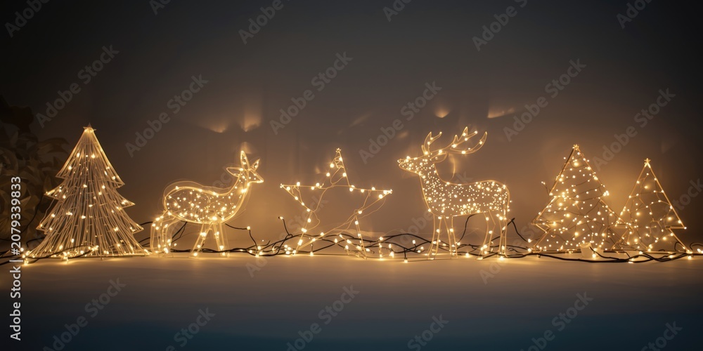 Fototapeta premium Lighted holiday decor elements set on a smooth backdrop