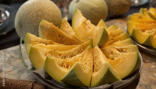 Sliced yellow melon on a pl...