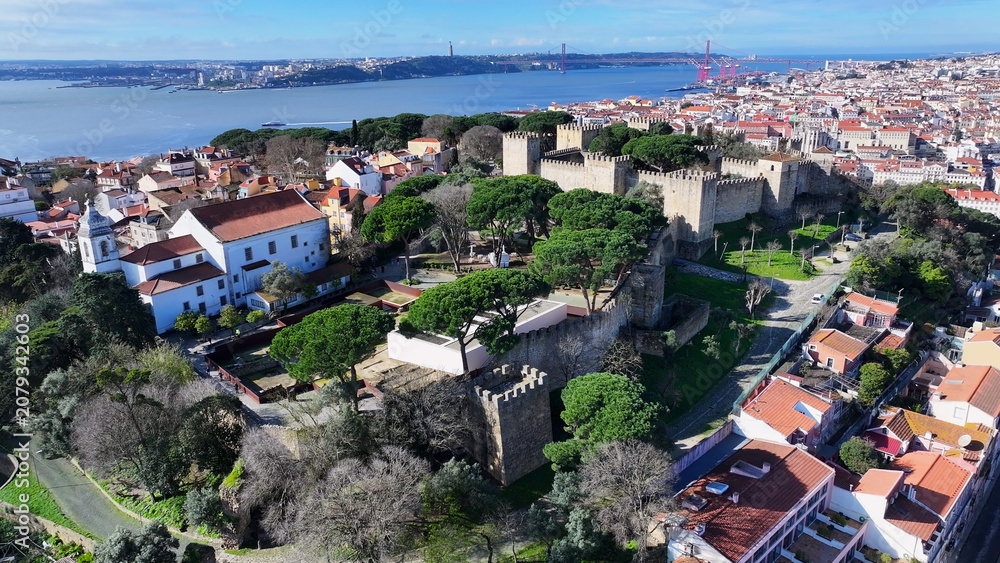 Fototapeta premium Sao Jorge Castle In Lisbon Portugal. Birds Eye View Of Medieval Building In Famous District Of City. Metropole Landscape Company Building Vibrant. Metropole Corporate Town. Lisbon Portugal.