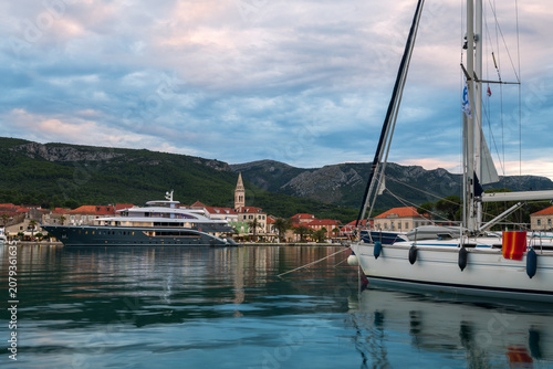 Luxury yachts and sailboats moored in Jelsa harbor, Hvar island
