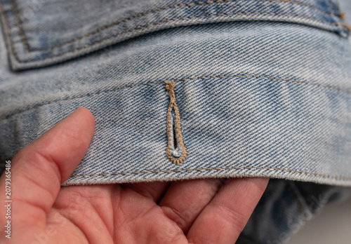 Fotografie Denim jacket buttonhole detail