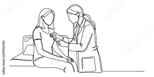Fotografie Female doctor using a stethoscope to examine a patient in a medical office conti