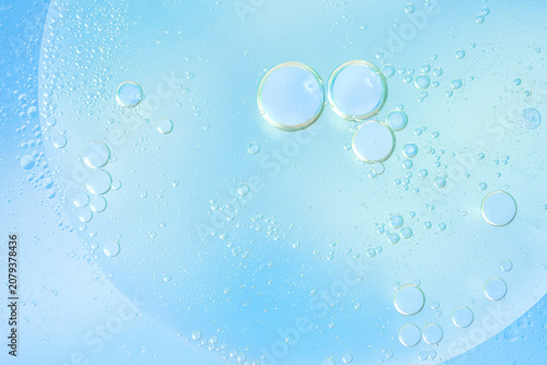 Soft blue abstract background with translucent bubbles, liquid texture, airy pastel tones, copy space