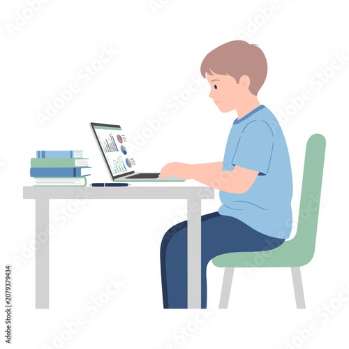 Fotografie Young boy concentrating at a laptop displaying charts with books on desk during