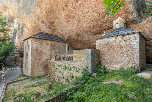 Botaya, Spain. Monasterio Viejo de San Juan de la Pena, a Romanesque monastery built into the rock face since the 9th-10th century, with its cloister, churches and chapels sheltered under the cliff