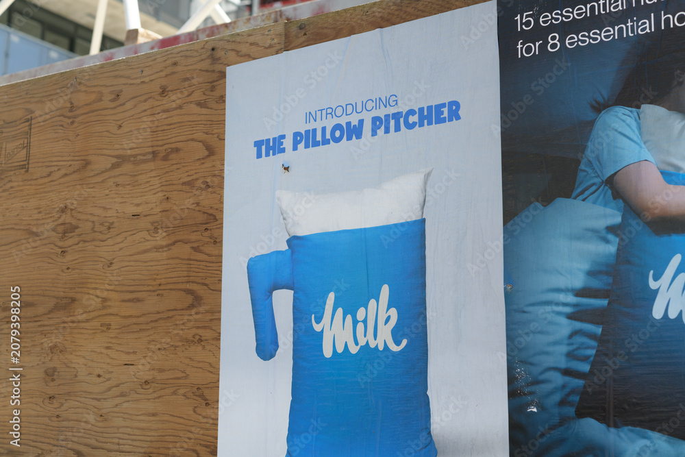 Obraz premium wheatpaste poster on plywood hoarding in Toronto (Milk, The Pillow Pitcher)