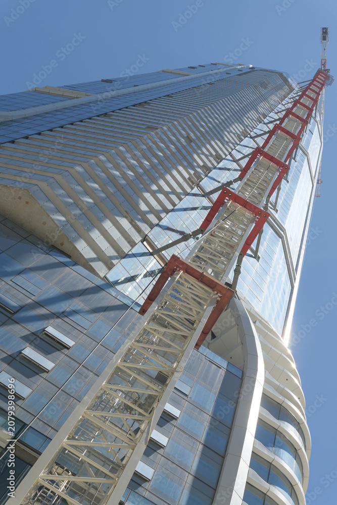 Obraz premium oblique angle view up of the SkyTower nearing completion at Pinnacle International, 1 Yonge St, Toronto