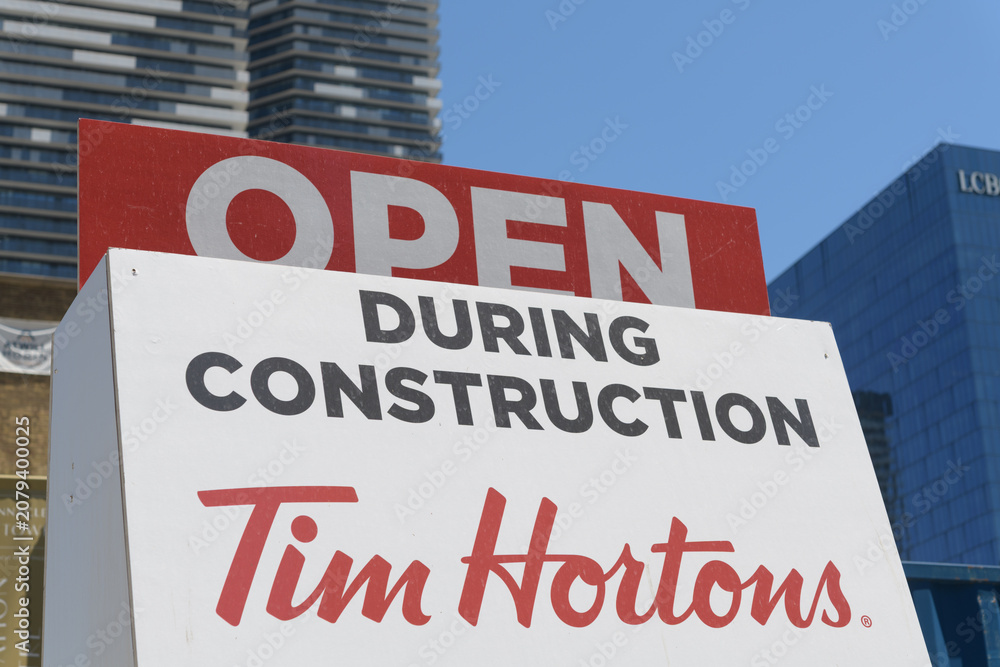 Obraz premium old Tim Hortons sign: open during construction, in Toronto's East Bayfront