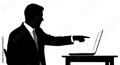 Businessman pointing at open laptop on desk