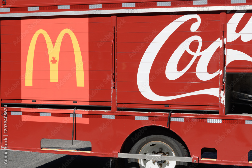 Obraz premium McDonald's Canada logo sign on a Coca-Cola side loader delivery vehicle in Toronto
