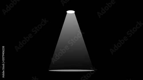 A single overhead spotlight projects a bright white cone of light downward onto an empty floor against a solid black background.