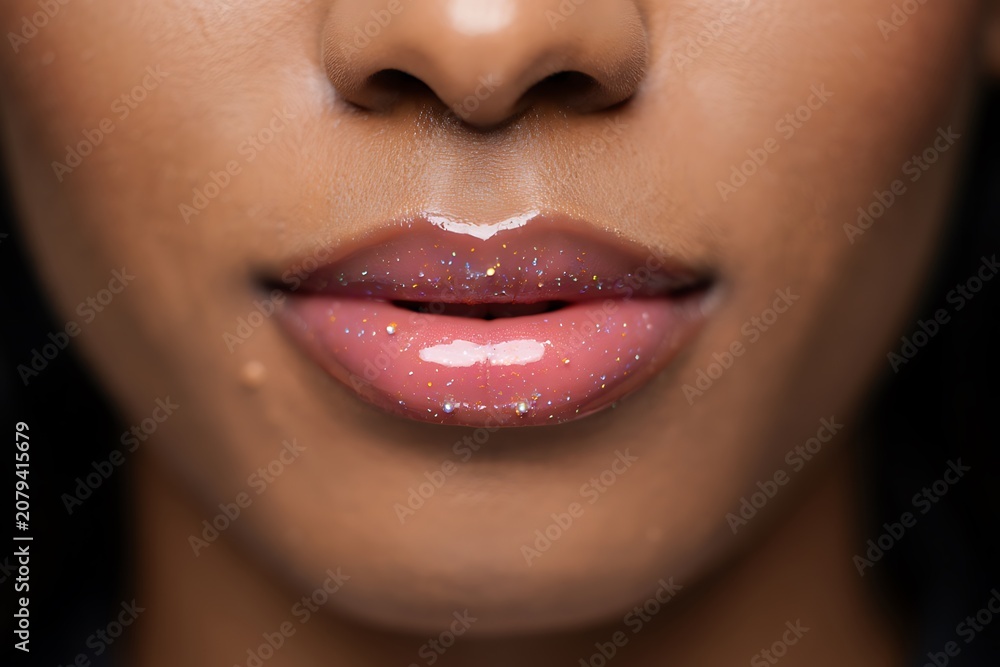 Naklejka premium Close-up of lips with glossy lipstick