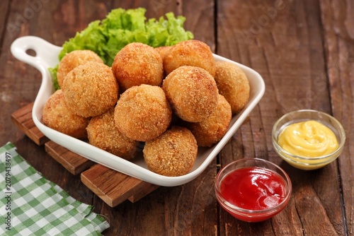 Quadro su tela Bitterballen, crispy golden-brown deep-fried meat croquettes with a rich, creamy beef ragout filling