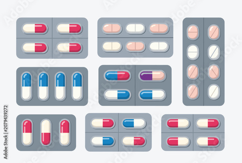 Collection of various pharmaceutical blister packs containing multi-colored capsules and tablets, representing medicine.